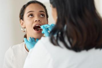 photo of a young woman have a dental examination