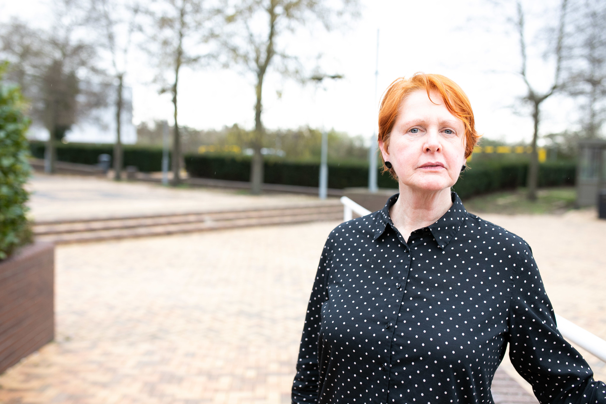 Woman looking at camera at a Healthwatch event 