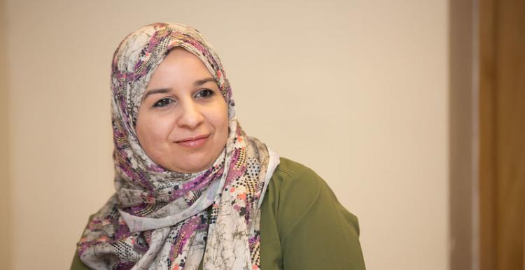 woman in headscarf smiling