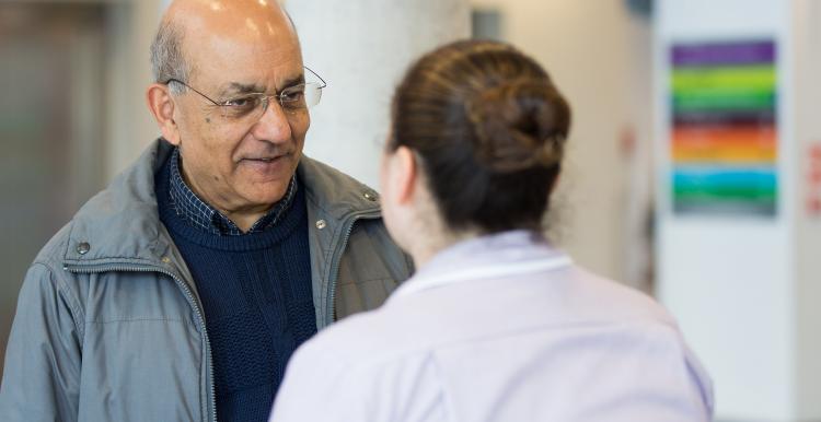 man talking to a nurse