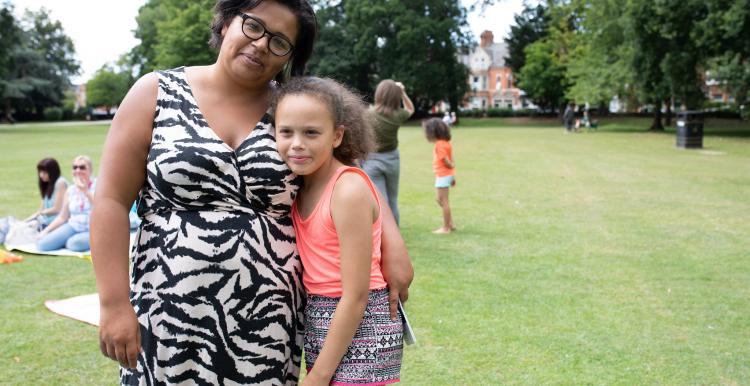 Mother and daughter smiling at the camera at Healthwatch event