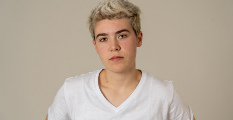 Some LGBTQ+ people are concerned about disclosing information to their GP and worry about discrimination and unequal treatment young trans teenager looking into camera