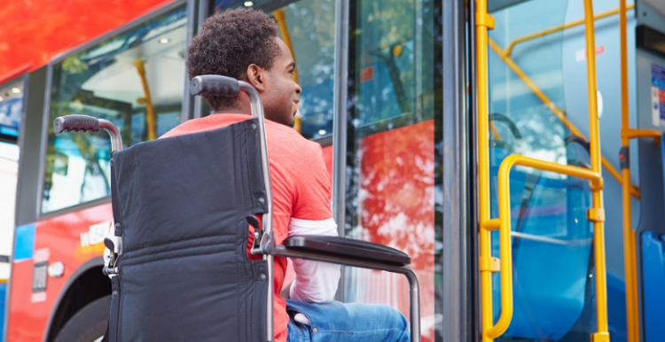 Our new report calls for more consultation on bus routes with older people and people with disabilities and sensory impairments man in wheelchair waiting to board a bus