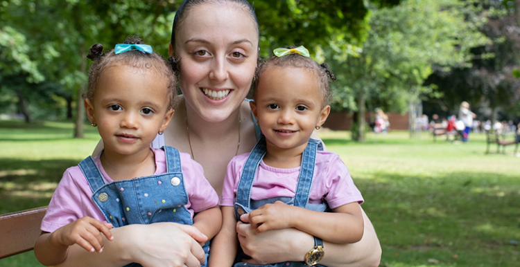 a young woman with her twin children