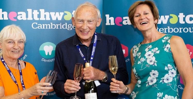 Three people making a farewell toast