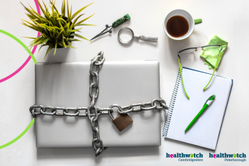 A laptop chained and locked up on a desk next to a plant, coffee cup and a pen and paper. Healthwatch Cambridgeshire and Peterborough logos in the bottom lefthand corner. 