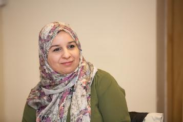 woman in headscarf smiling