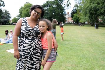 Mother and daughter smiling at the camera at Healthwatch event