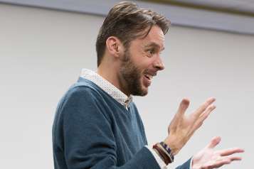 Picture shows Deaf man communicating in British Sign Language 