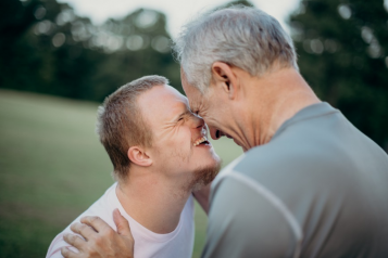 father and son laughing