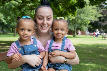 a young woman with her twin children