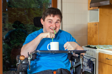 Picture shows disabled man in his kitchen 