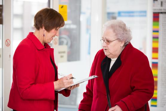 Picture shows Healthwatch volunteer talking to a member of the public Healthwatch volunteer talking to memebr of the public