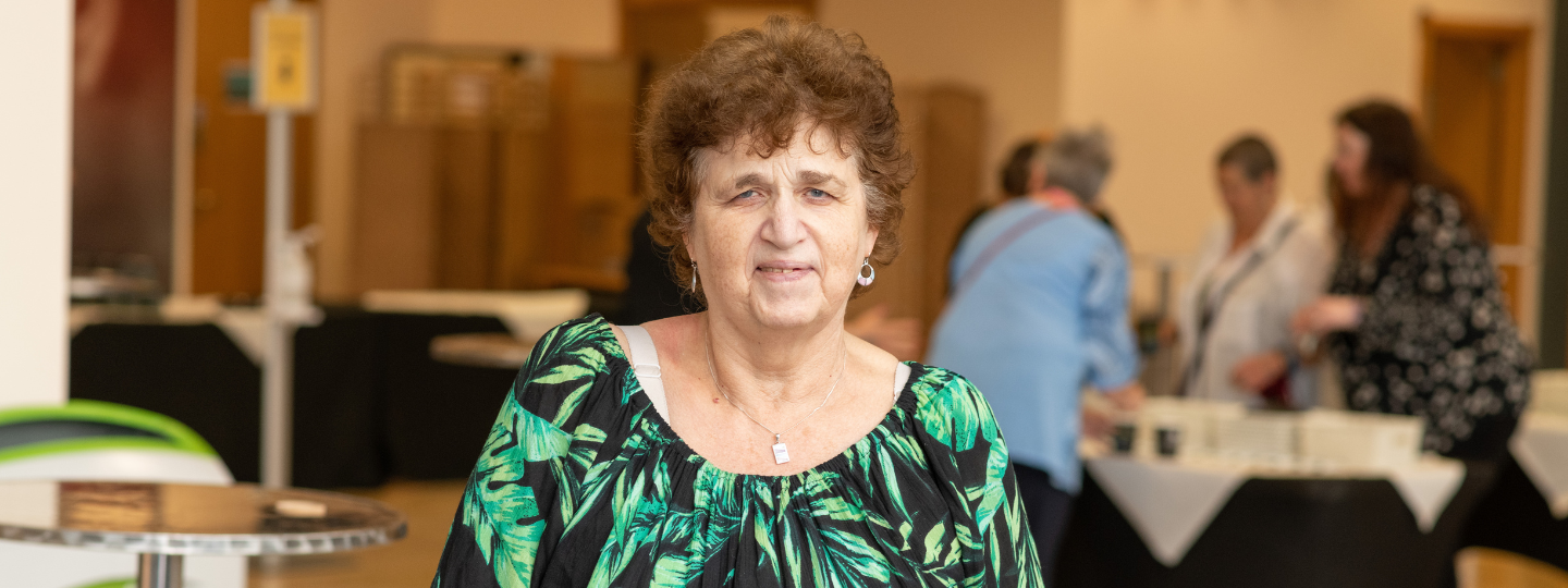 Woman looking at camera at a Healthwatch event