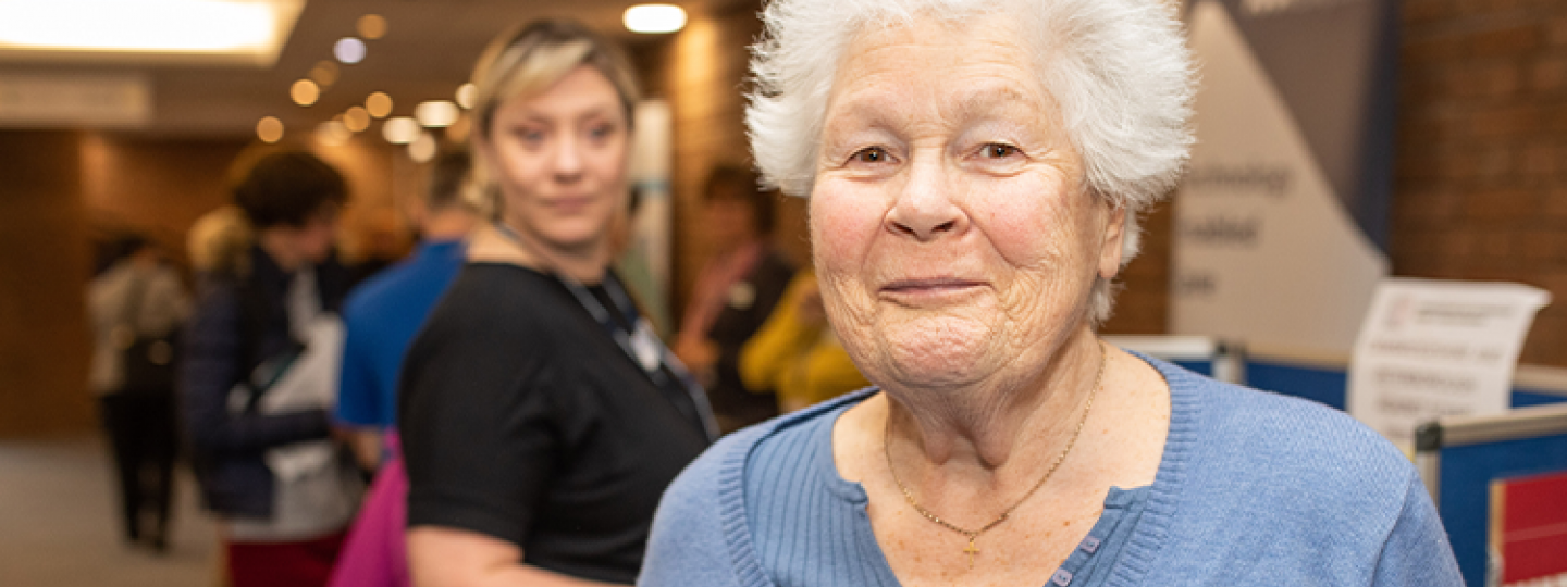 an older woman looking at the camera