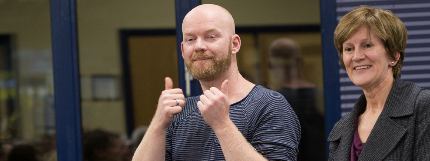 deaf man communicating at a Healthwatch  event