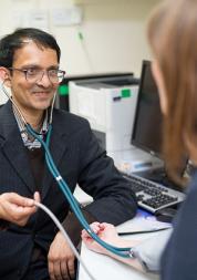 Picture shows a GP taking the bloodpressure of a female patient