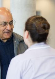 aisan man talking to nurse