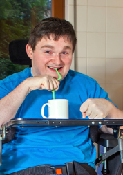 Picture shows disabled man in his kitchen 